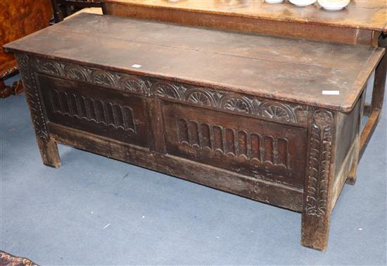 An 18th century panelled oak coffer W.154cm